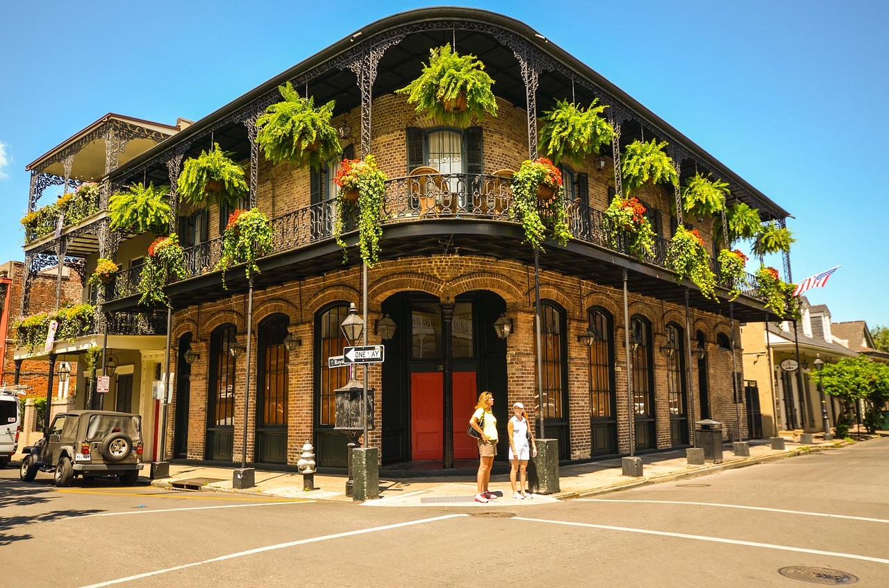 Classic French Quarter charm in the heart of New Orleans, where historic balconies, vibrant greenery, and timeless architecture create the perfect Southern atmosphere.